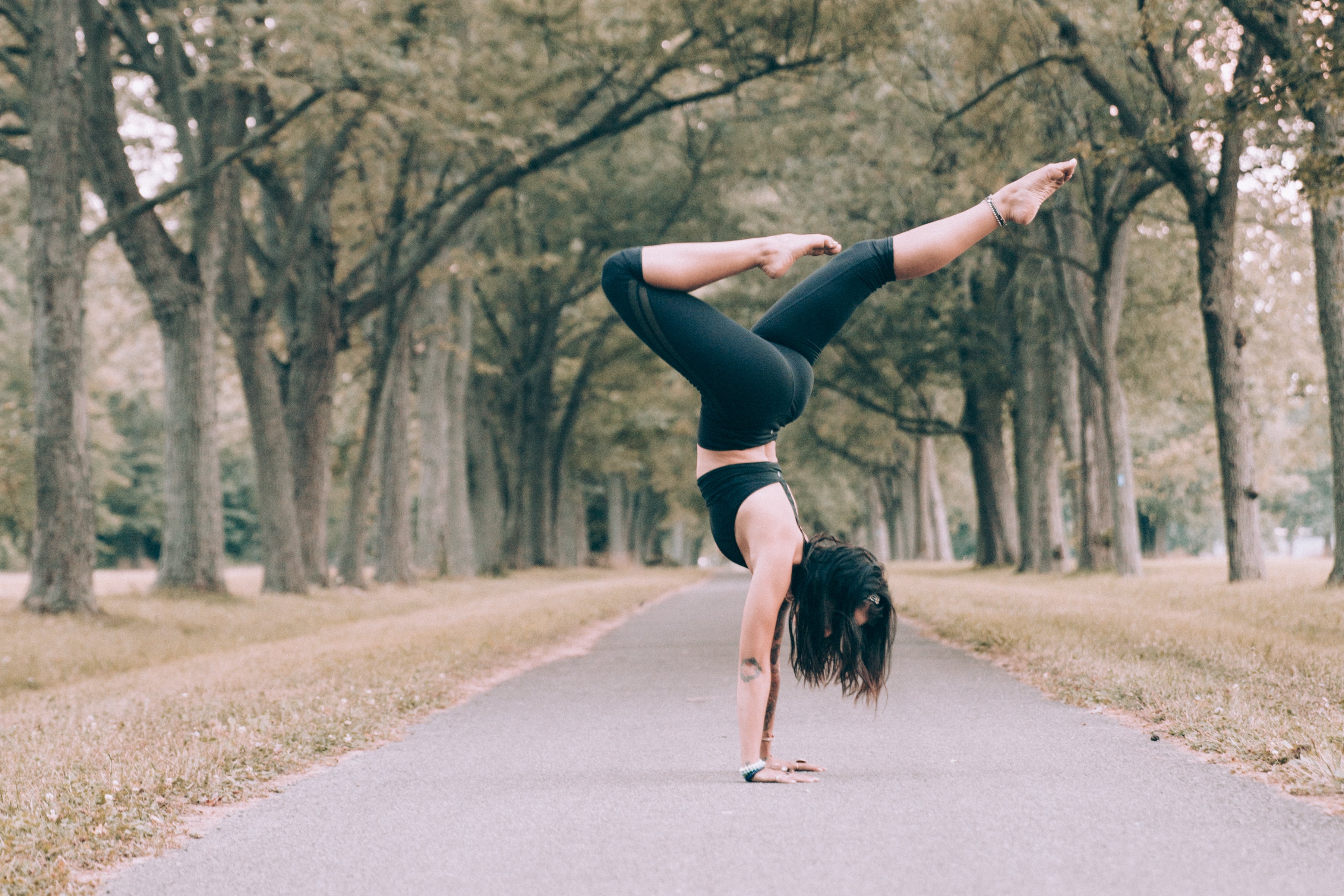 Woman performing a pilates hand stand